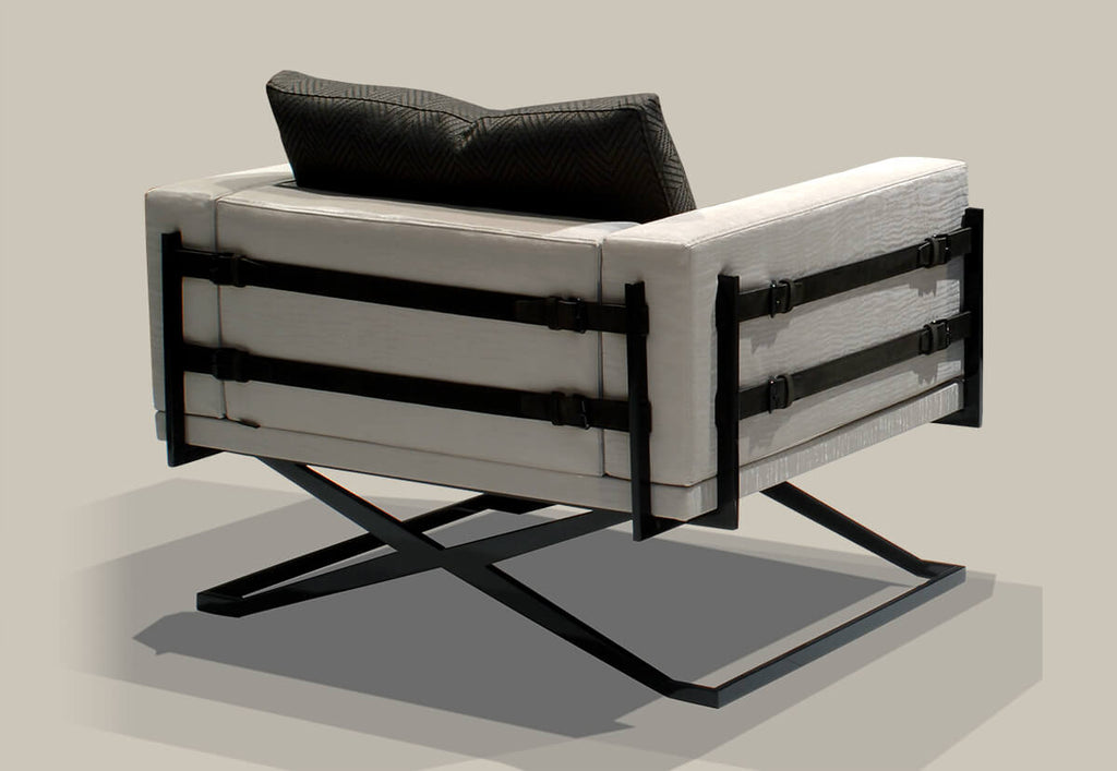 Rome Chair with white upholstery, dark gray pillow, and unique black metal frame