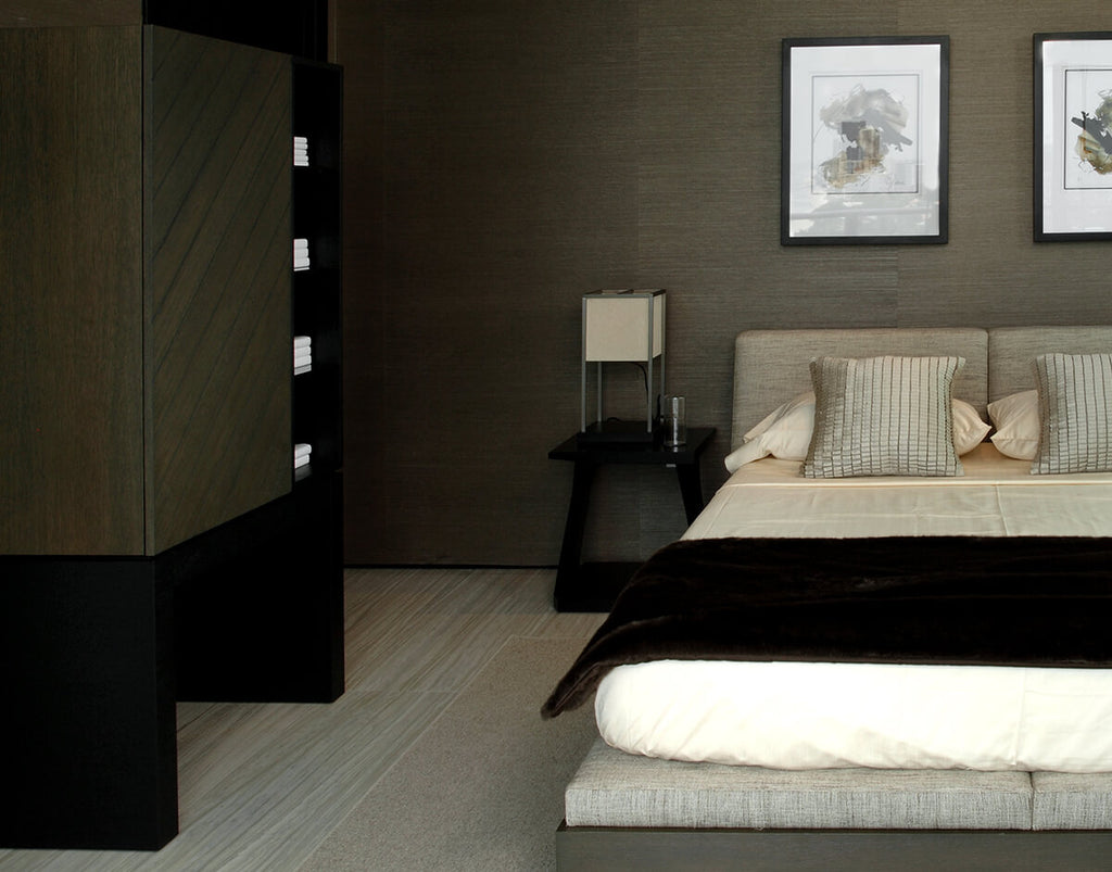 Modern bedroom with Athens Console lacquered steel table lamp and wall art
