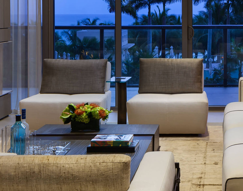 Modern living room with Lucca Chair and coffee table, stylish armless seating option