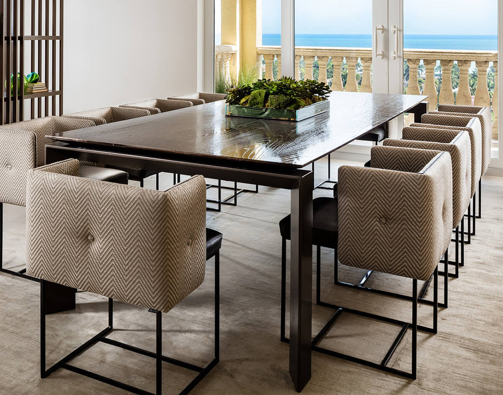 Cairo Table long dark wood dining table with upholstered herringbone chairs