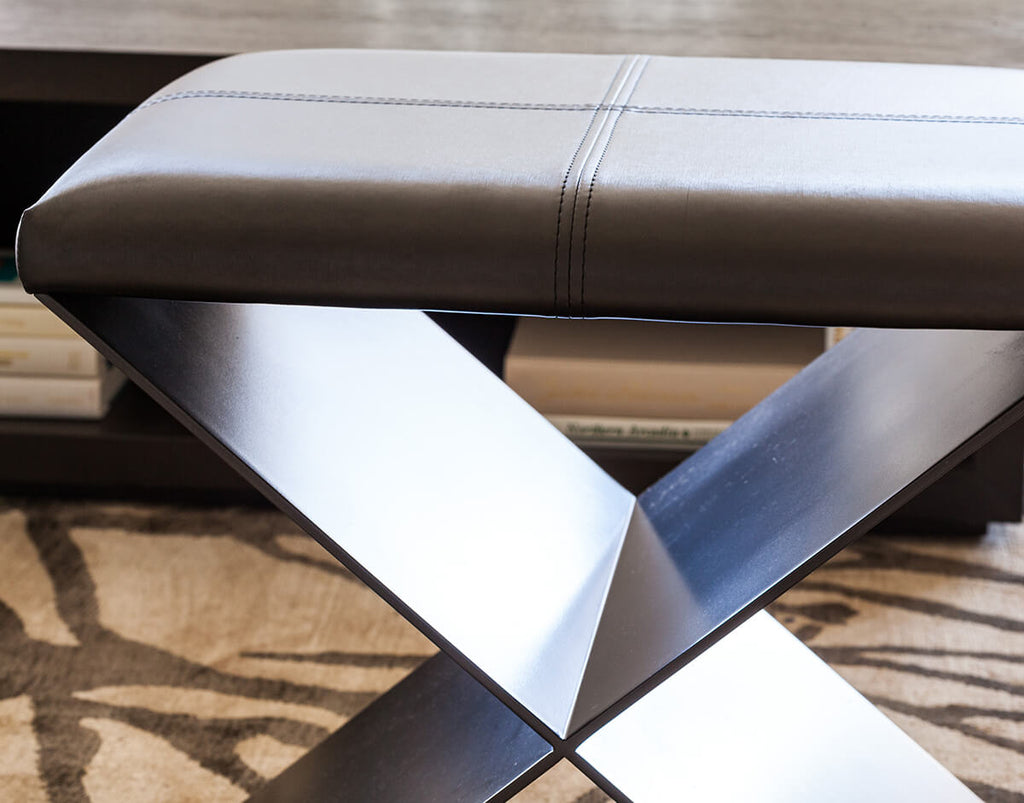 Santorini Stool with brown leather top and dark metal X-shaped base for modern decor