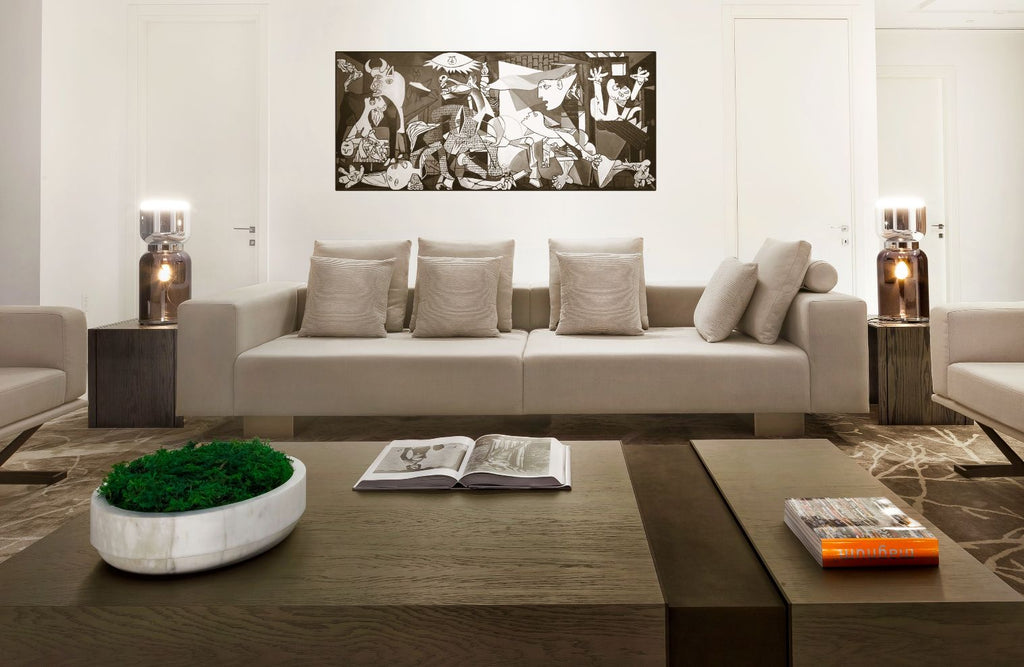 Modern living room with Amsterdam Sofa, large sofa, coffee table, and abstract artwork