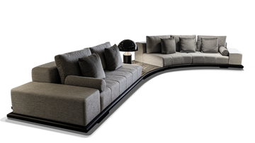 Greenwich Sofa curved modular sofa with light grey upholstery and dark accent pillows