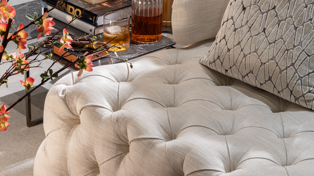 Light-colored tufted fabric ottoman from Versailles Sofa for elegant living room decor