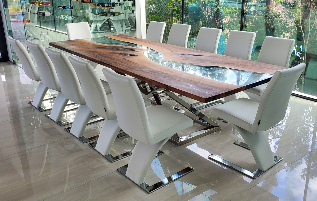 Abruzzo Walnut Dining Table with wood slabs, resin river, and white leather chairs