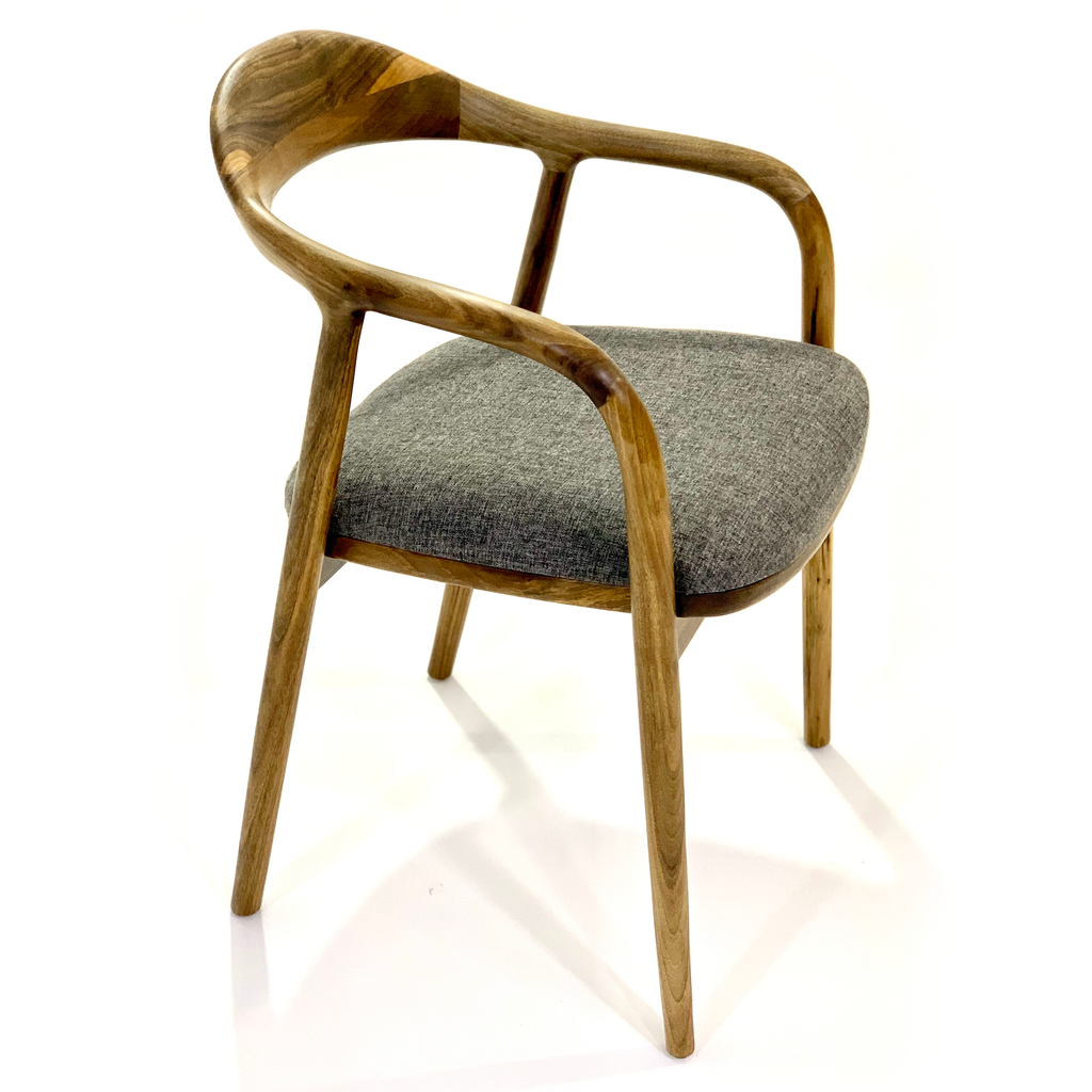 Arkas Dining Chair with wooden frame, curved back, arms, and grey fabric seat
