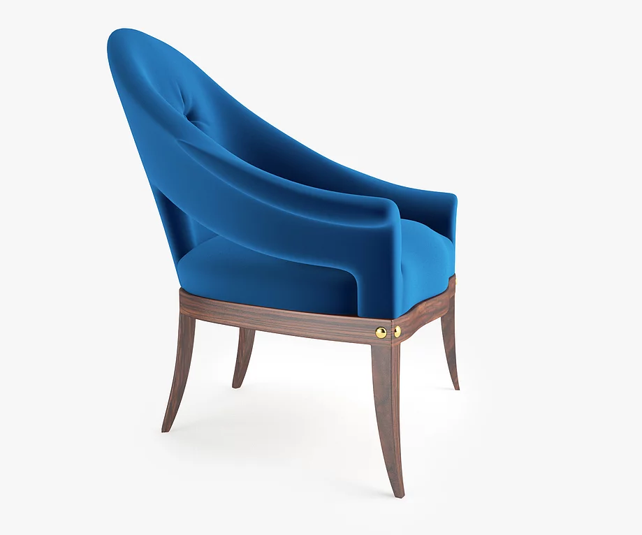 Modern blue velvet Avalon Chair with dark wood base and brass accents