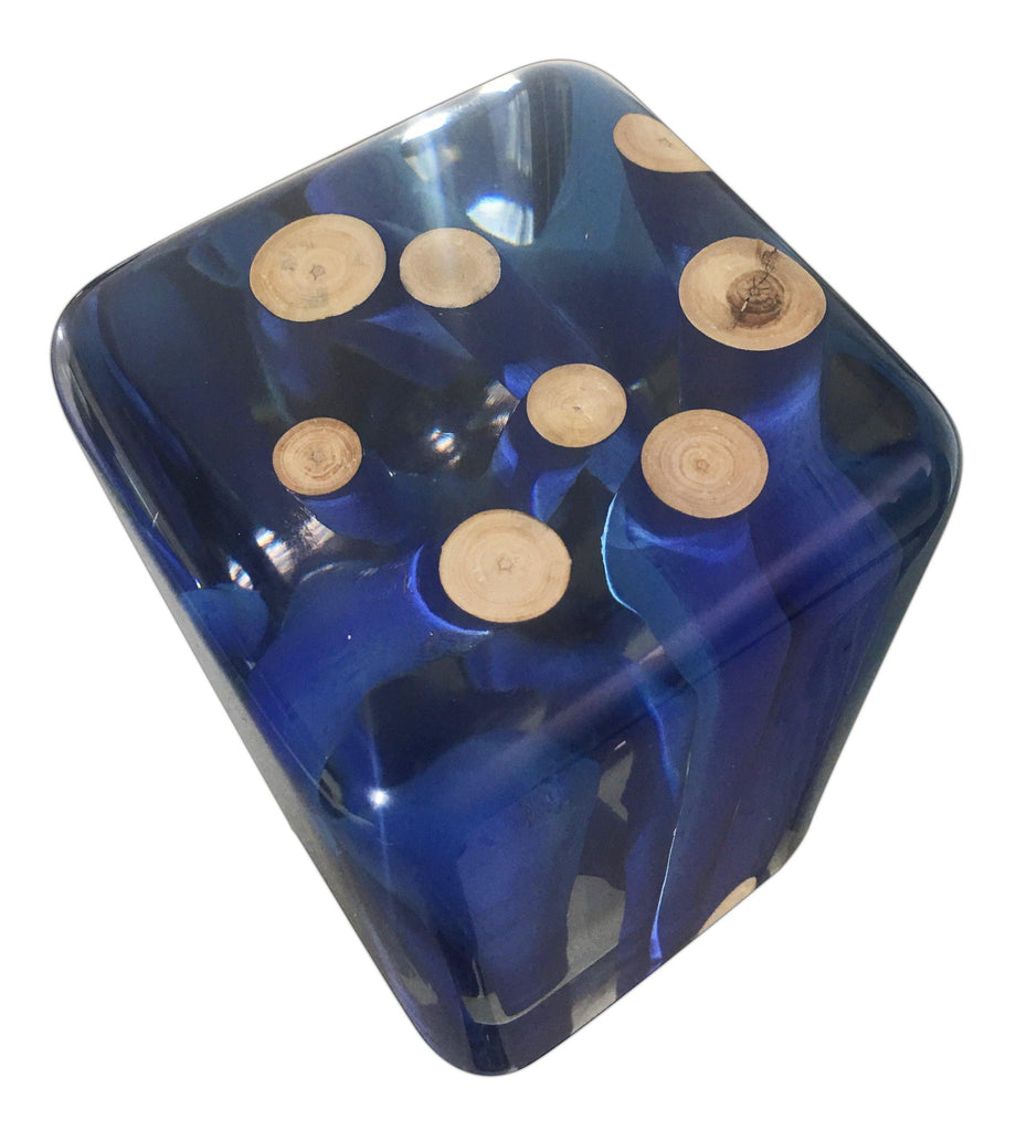Translucent dark blue resin dice with embedded light brown wood slices in Blue Branches Cube style