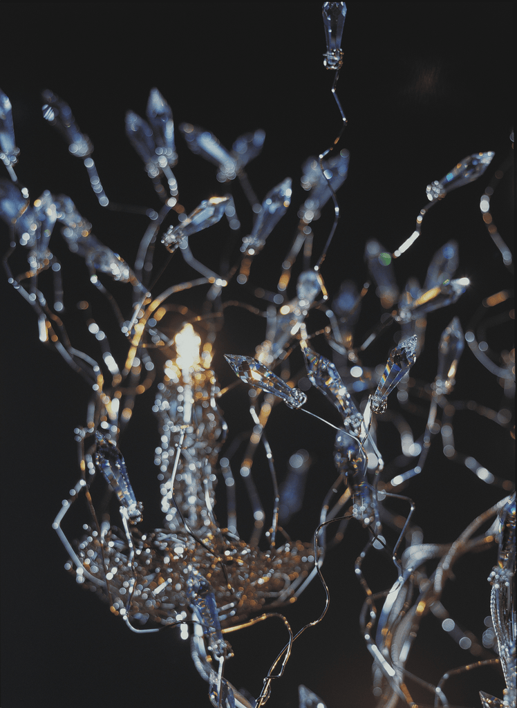 Illuminated crystal chandelier from Candles And Spirits Chandelier Oval, a stunning chandelier oval design