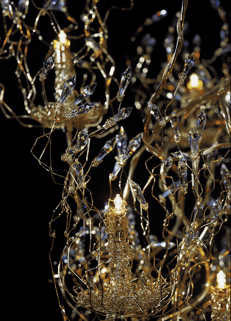 Intricate gold spirits chandelier round with dangling crystal accents for elegant decor