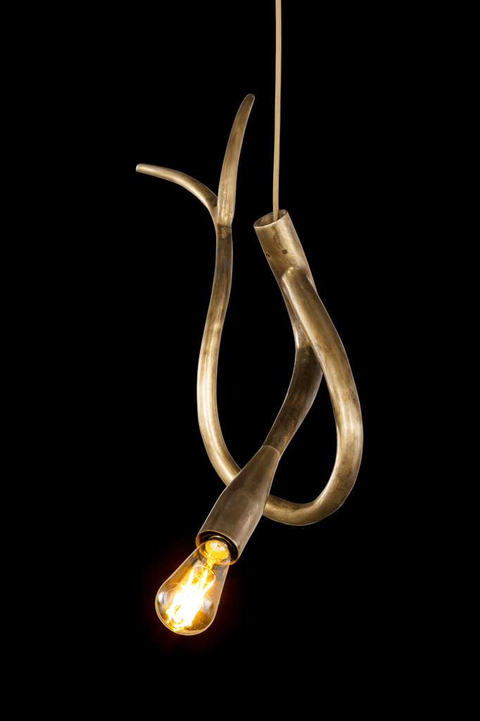 Antique brass-finished pendant light with abstract design and exposed Edison bulb in Edisons Tail Element 4