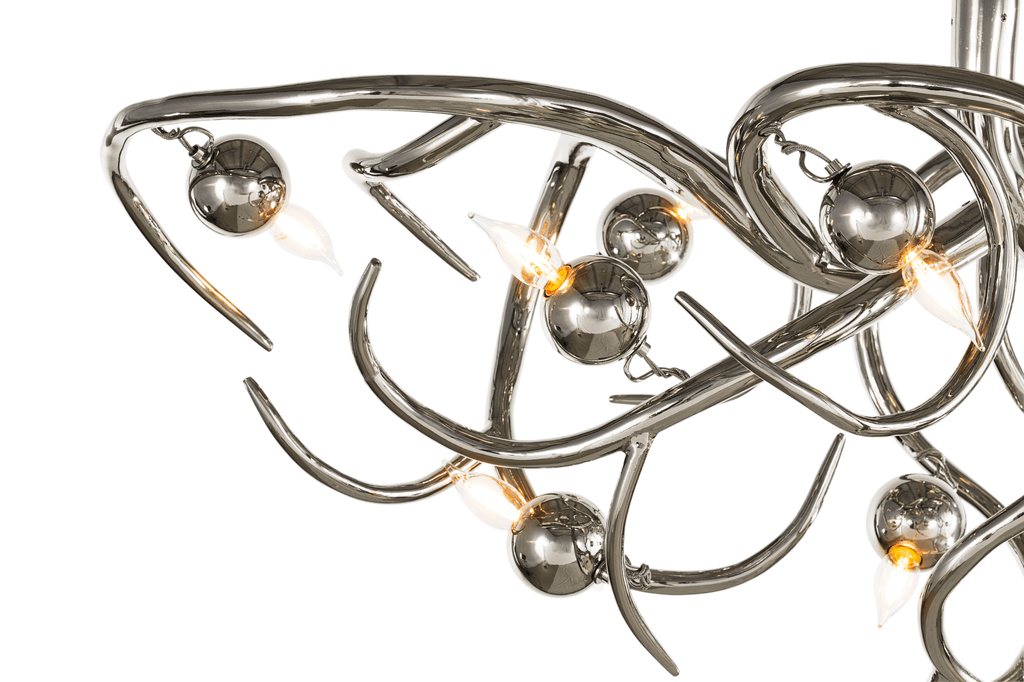 Eve Chandelier Oval with modern silver branches and warm spherical accents