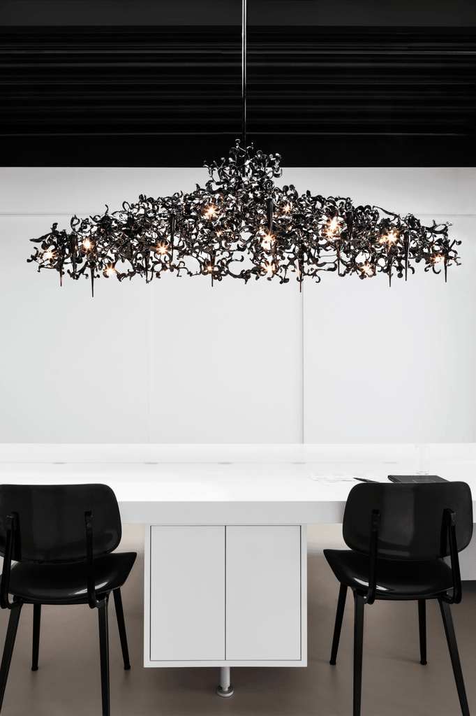 Flower Power Chandelier Oval with an elaborate black organic design and exposed bulbs
