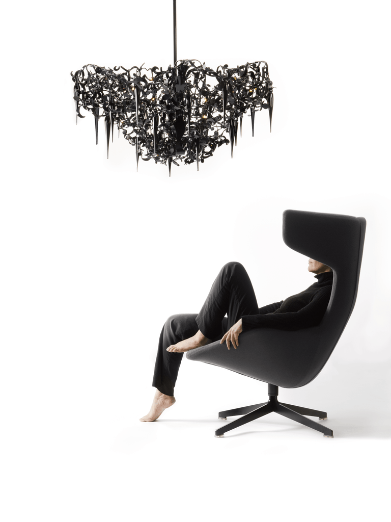 Black flower power chandelier round upside down with icicle-like dangling forms, coffee table ready