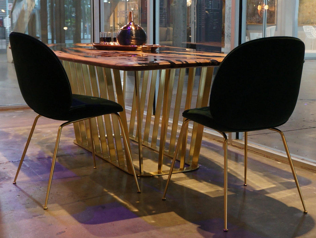 Giona Olive Dining Table with gold slatted base and dark velvet chairs for stylish olive dining