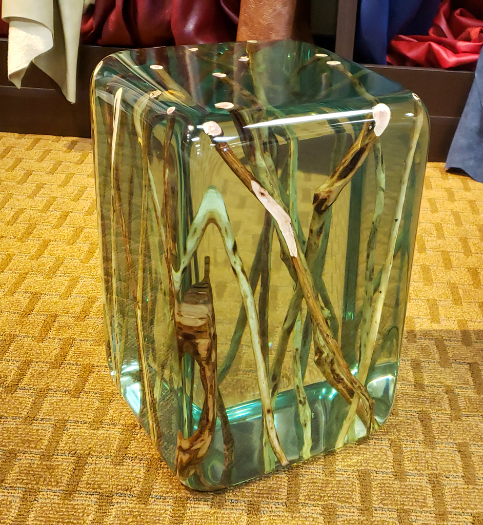 Green branches end table featuring clear resin with embedded natural branches for a stylish look