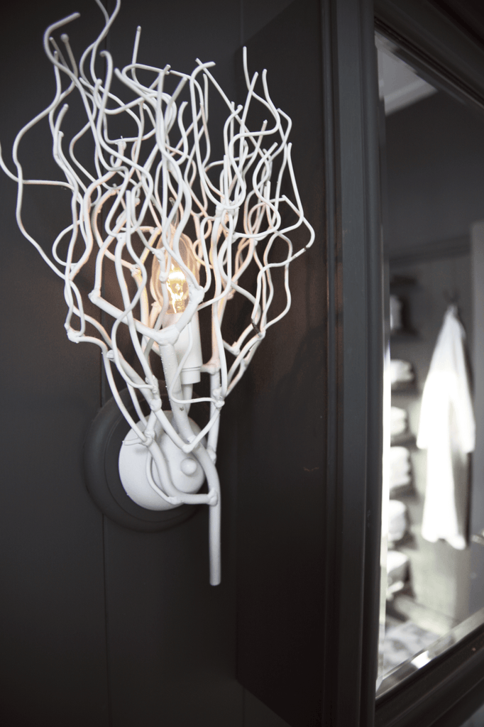 White branch-like Hollywood Wall Lamp with exposed light bulb for modern wall decor