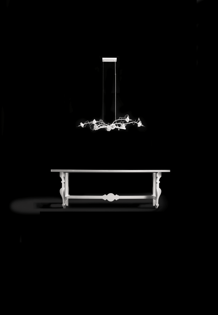 Elegant White ornate dining table with La Vie En Rosa hanging lamp and matching chandelier