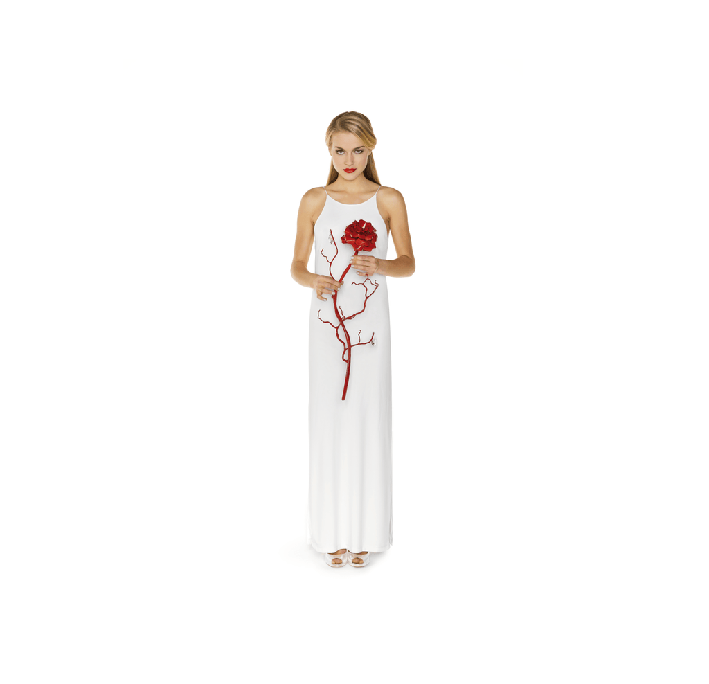 Woman in white maxi dress holding La Vie En Rosa Rosa Single Decoration Rose with floral top