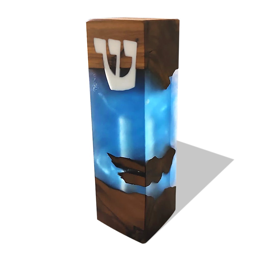 Modern mezuzah case with wood and blue resin and a white Hebrew letter shin