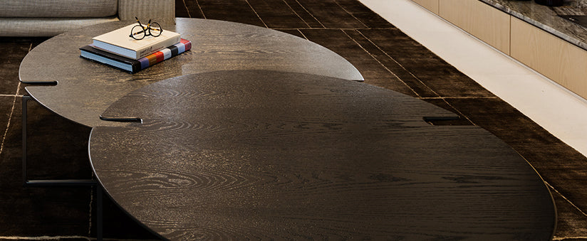 Moscow Table with two overlapping dark-toned oval wooden coffee tables in modern design