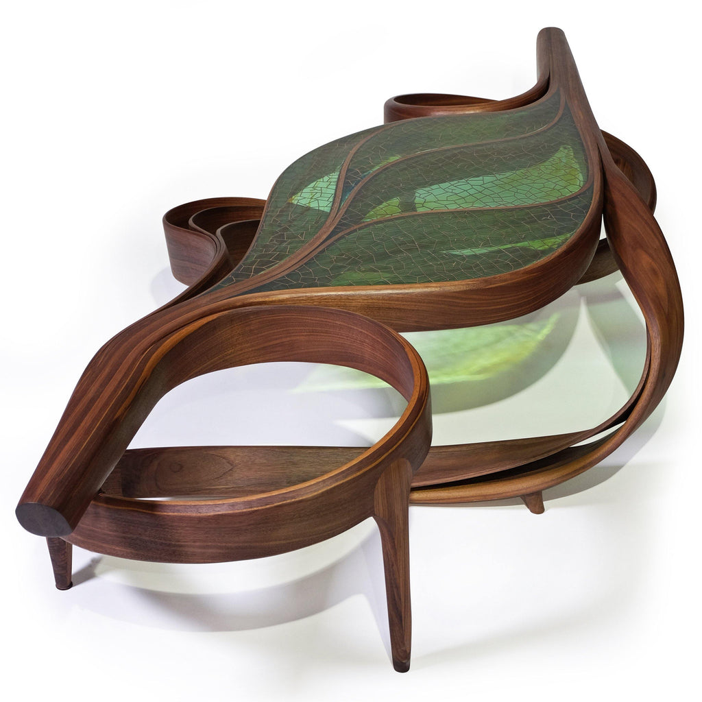 Intricately designed wooden chaise lounge with leaf-shaped green-tinted seat for Natural Ivy Coffee Table