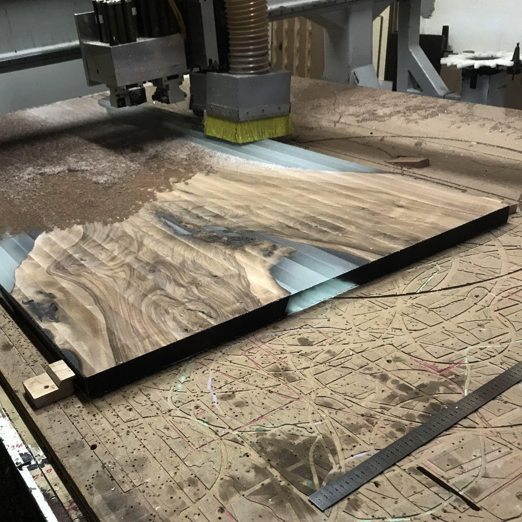 CNC carving a wooden slab with resin inlay for Ombrone Walnut Dining Table