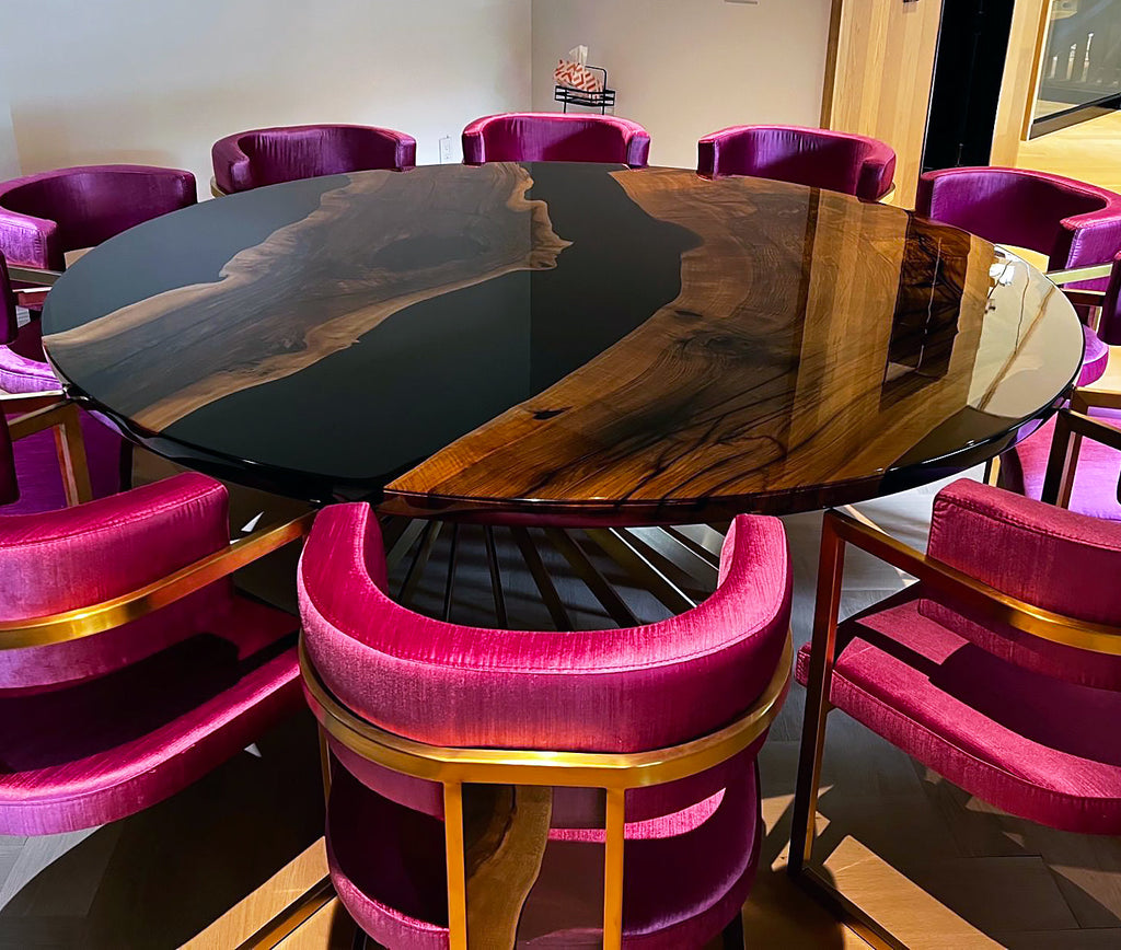 Panaro Walnut Wood Round Dining Table with dark resin and velvet chairs