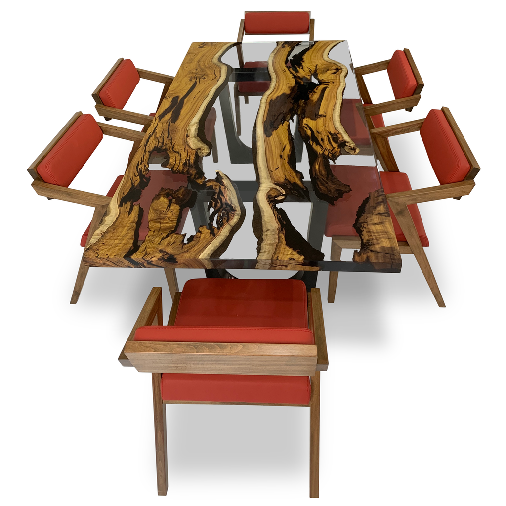 Vernazza Dining Chair set around a natural wood slab dining table with glass top