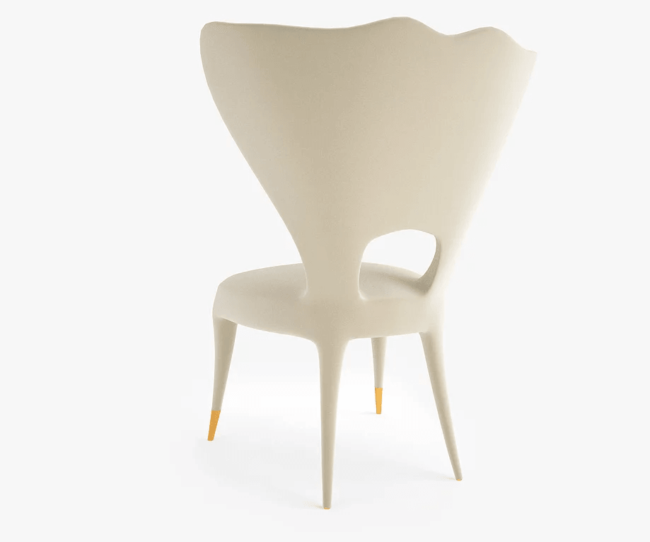 Victory Chair off-white plastic chair with flared back and gold-tipped legs