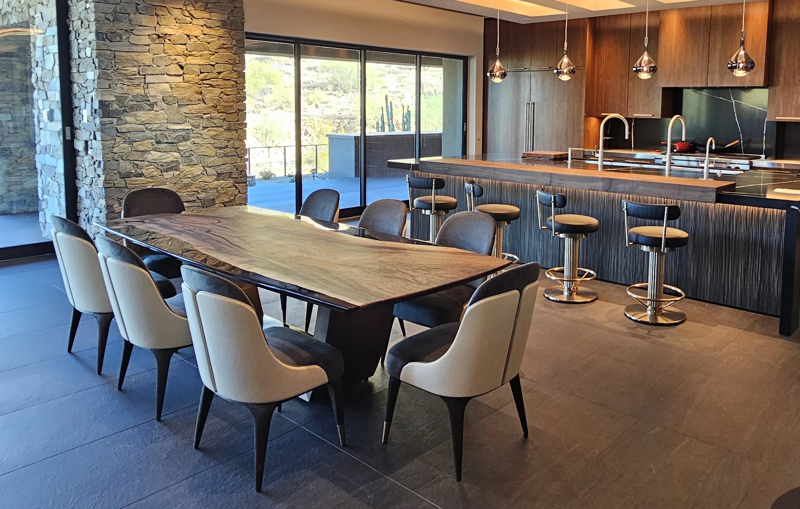Evadne bespoke dining table in Anatolian walnut and Battleship Gray transparent resin within a private residential interior.